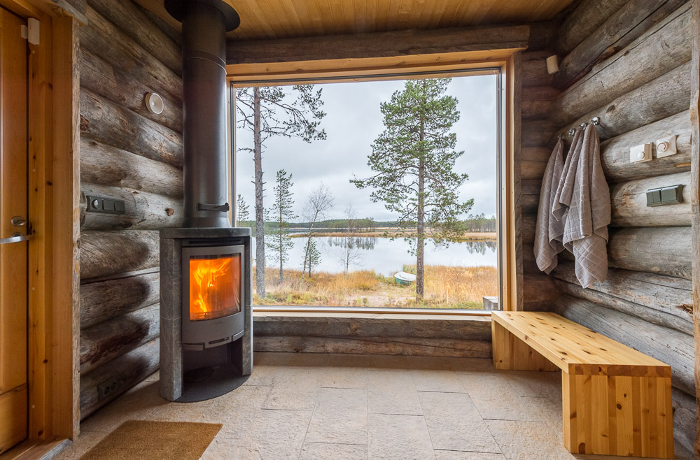Fireplace in lakeside sauna
